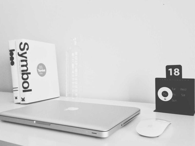 Sleek modern desk setup with an open laptop, reflecting an advanced financial analytics interface, well lit corporate environment, highly detailed, no human figures